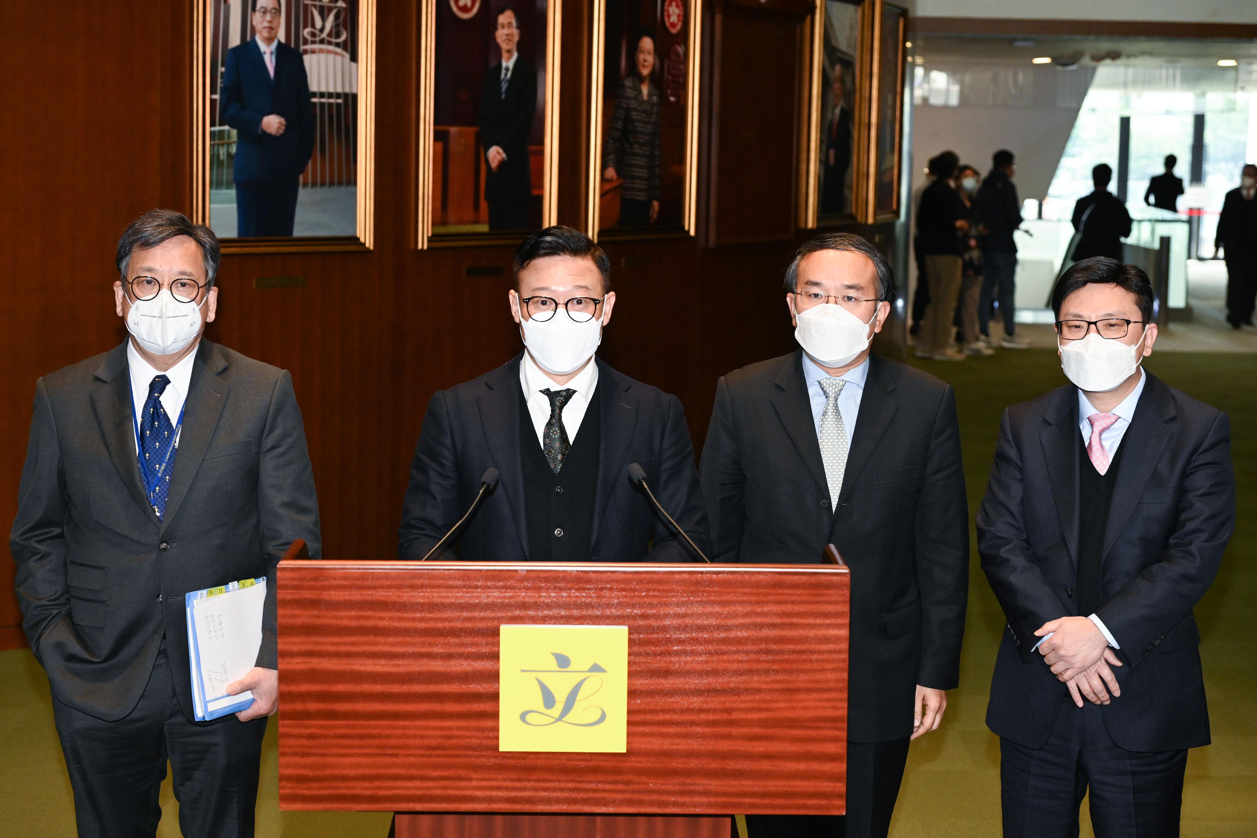 The Deputy Secretary for Justice, Mr Cheung Kwok-kwan (second left); the Secretary for Financial Services and the Treasury, Mr Christopher Hui (second right); the Secretary for Commerce and Economic Development, Mr Algernon Yau (first left); and the Secretary for Labour and Welfare, Mr Chris Sun (first right), meet the media after attending the Ante Chamber exchange session at the Legislative Council today (February 15).