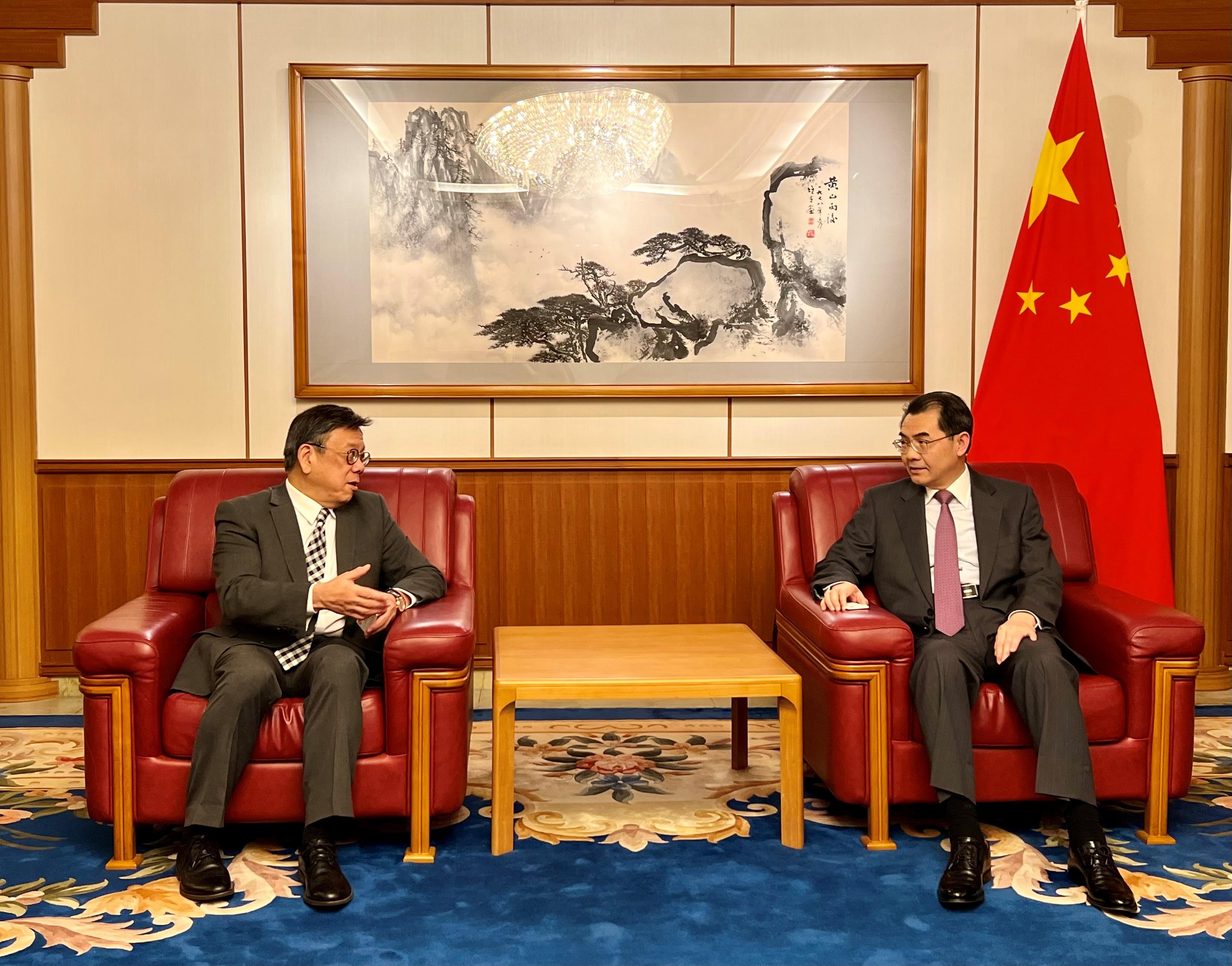 The Secretary for Commerce and Economic Development, Mr Algernon Yau (left), pays a courtesy call on the Chinese Ambassador to Japan, Mr Wu Jianghao (right), in Tokyo, Japan, today (June 19), to give him an update on Hong Kong's latest developments.