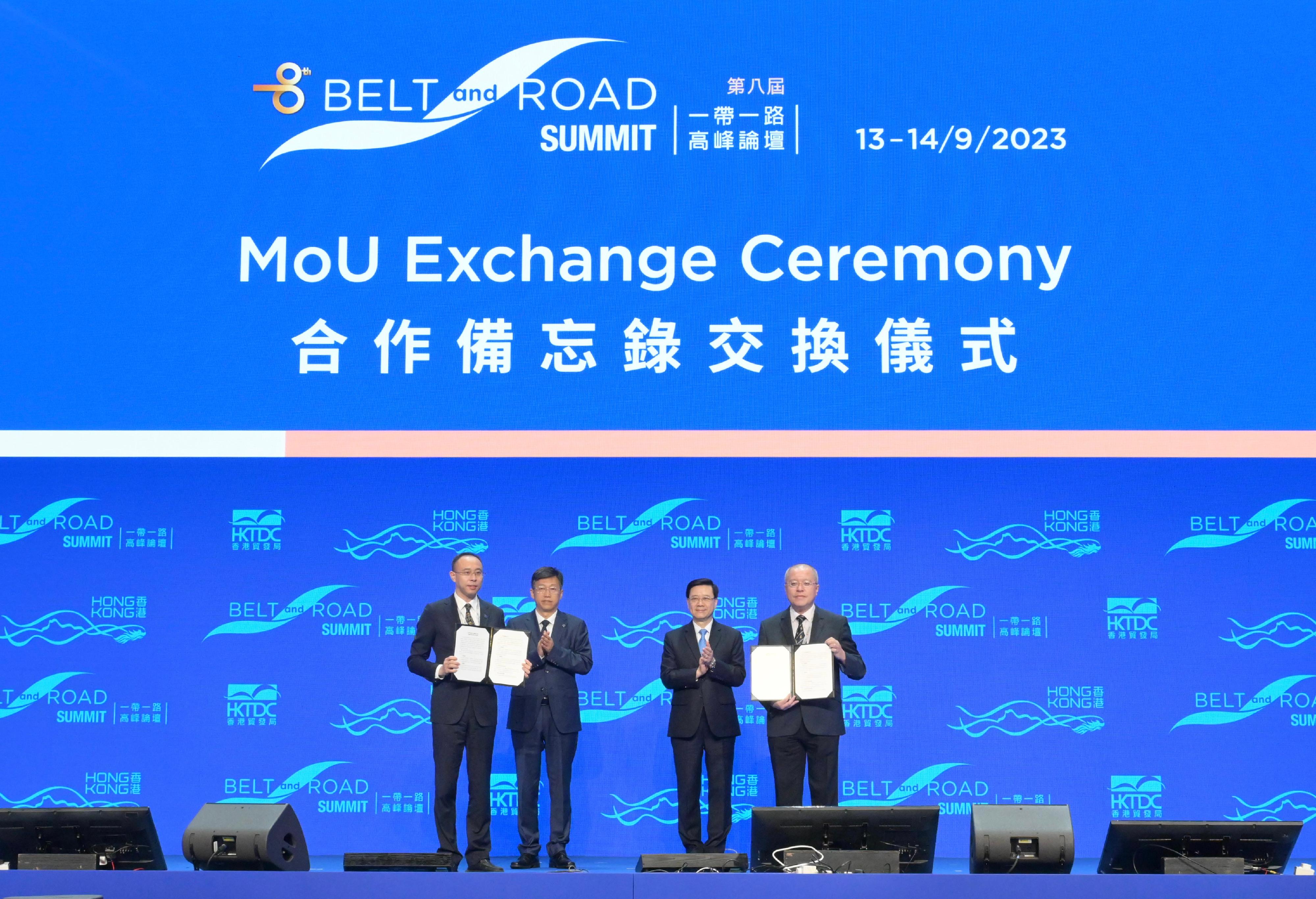 The Chief Executive, Mr John Lee, attended the eighth Belt and Road Summit today (September 13). Photo shows Mr Lee (second right) witnessing the Director of the Hong Kong Observatory, Dr Chan Pak-wai (first right), exchanging the Memorandum of Understanding with the representatives from the China Meteorological Administration.
