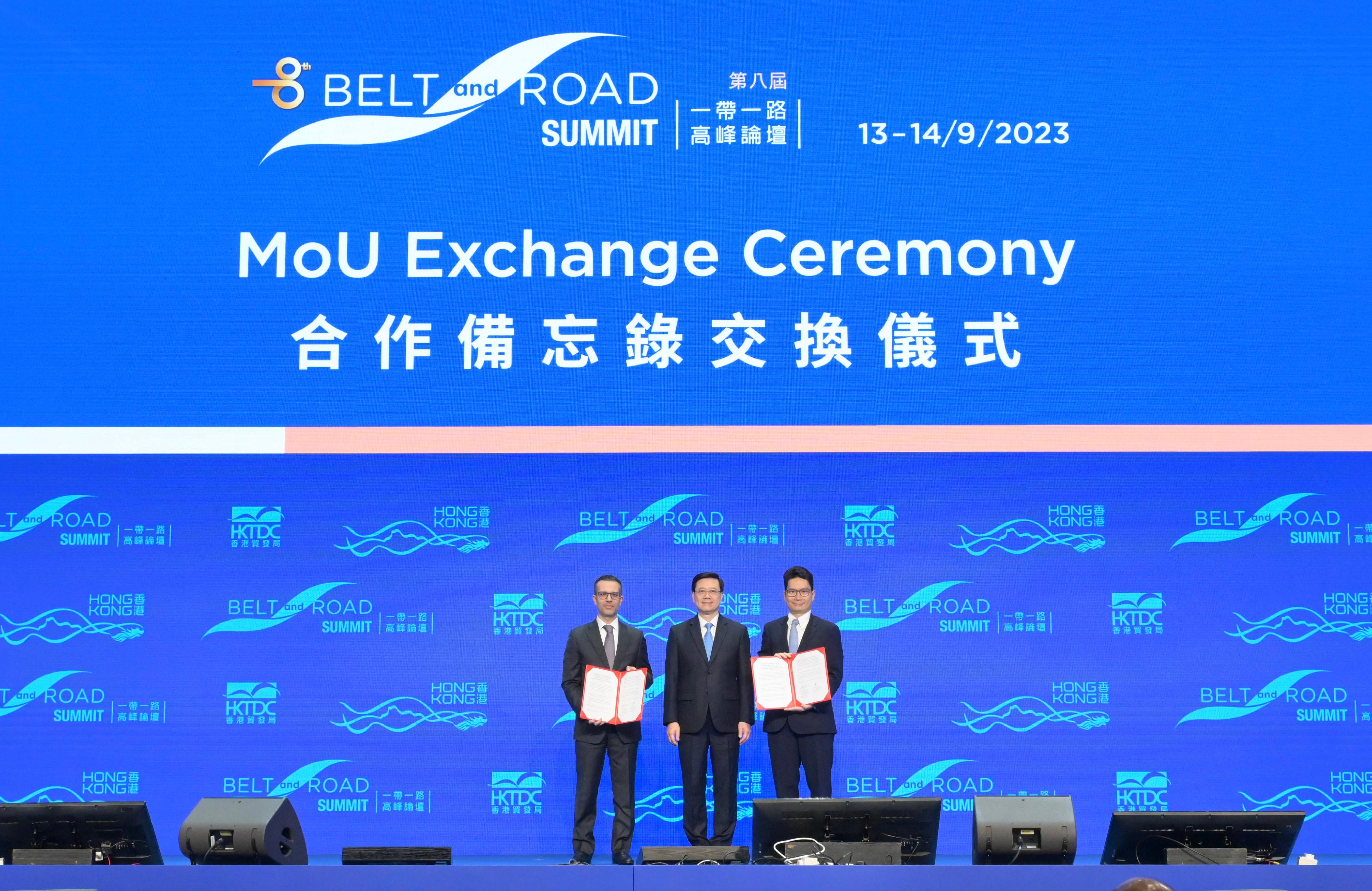 The Chief Executive, Mr John Lee, attended the eighth Belt and Road Summit today (September 13). Photo shows Mr Lee (centre) witnessing the Under Secretary for Financial Services and the Treasury, Mr Joseph Chan (right), exchanging the Memorandum of Understanding with the representative from the Department of Economy and Tourism of Dubai.