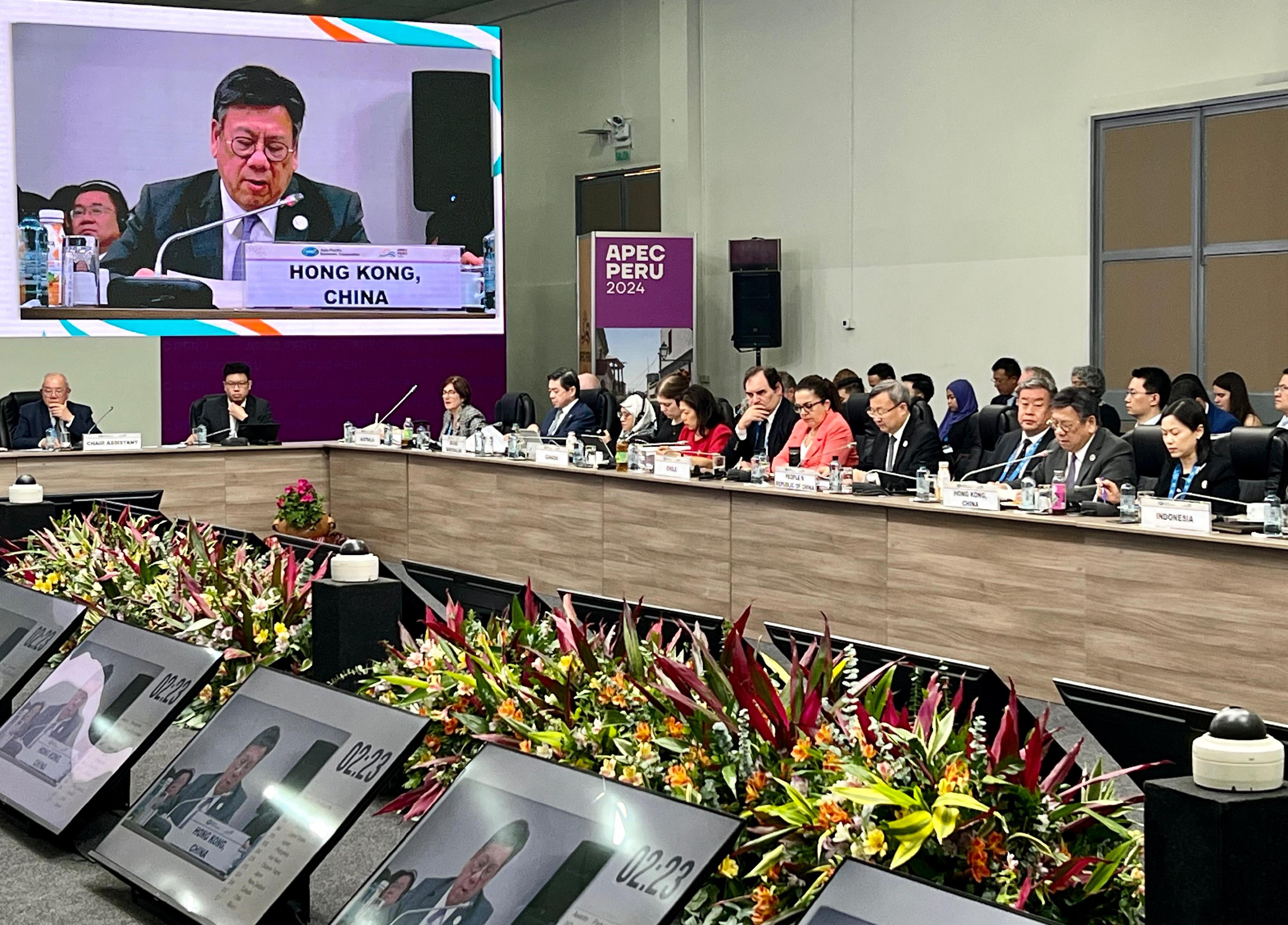 The Secretary for Commerce and Economic Development, Mr Algernon Yau (front row, second right), speaks at a discussion session entitled "Trade Facilitation and Trade and Inclusion" at the Asia-Pacific Economic Cooperation Ministers Responsible for Trade Meeting in Arequipa, Peru, on May 18 (Arequipa time). Looking on is the Director-General of Trade and Industry, Ms Maggie Wong (front row, first right).