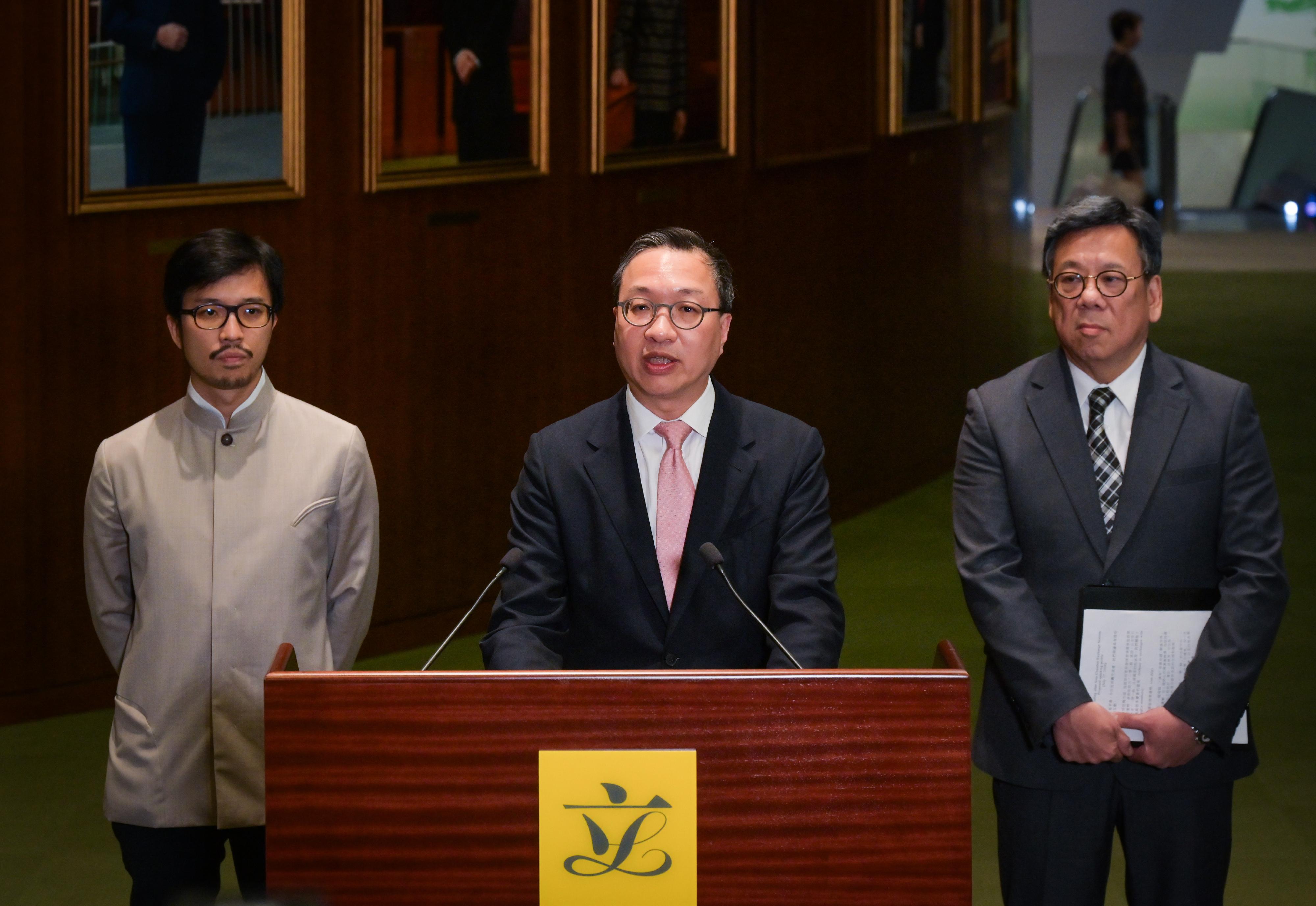 The Secretary for Justice, Mr Paul Lam, SC (centre); the Secretary for Commerce and Economic Development, Mr Algernon Yau (right); and the Commissioner for Belt and Road, Mr Nicholas Ho (left), meet the media after attending the Ante Chamber exchange session at the Legislative Council today (July 17).