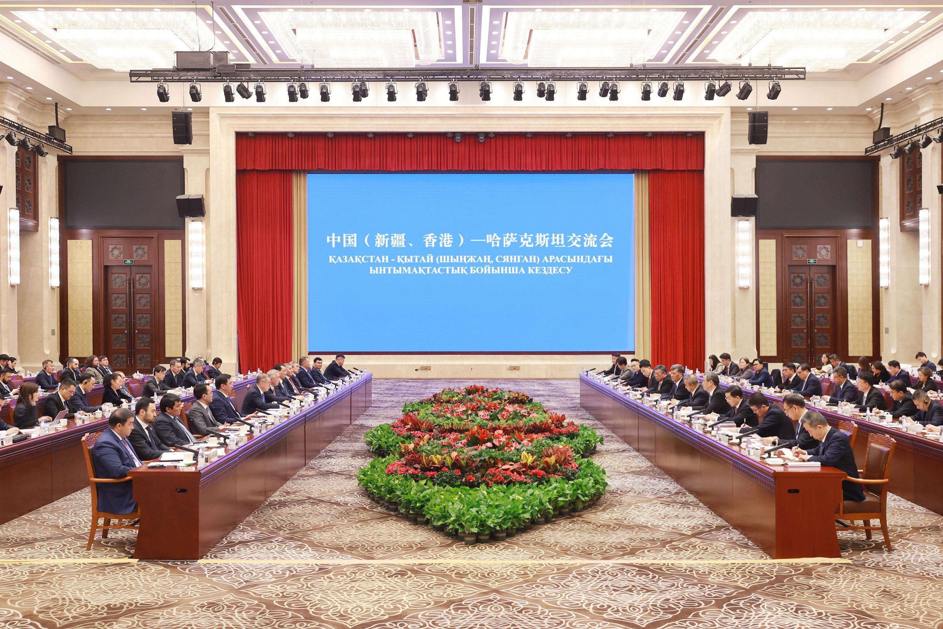 Leading a business delegation to visit Urumqi, Xinjiang, the Secretary for Commerce and Economic Development, Mr Algernon Yau (front row, eighth right), meets with the Secretary of the CPC Xinjiang Uyghur Autonomous Regional Committee, Mr Ma Xingrui (front row, seventh right); the Chairman of Xinjiang Uyghur Autonomous Region, Mr Erkin Tuniyaz (front row, sixth right); and Deputy Prime Minister of Kazakhstan Mr Serik Zhumangarin (front row, seventh left) on December 5 to exchange views on promoting economic and trade co-operation among the three places, with a view to jointly exploring the full range of opportunities arising from the Belt and Road Initiative.