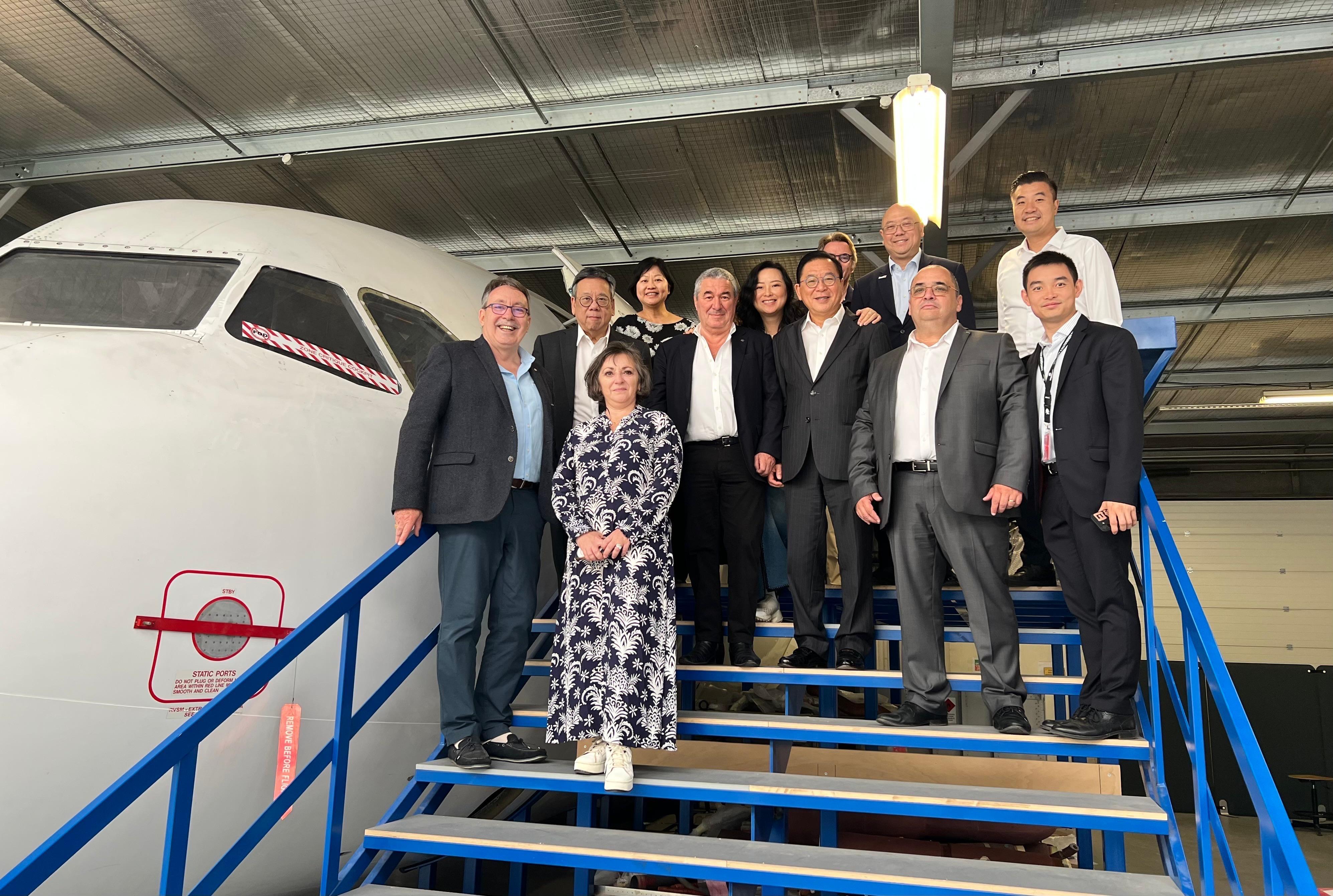 The Secretary for Commerce and Economic Development, Mr Algernon Yau, began his visit to France on June 18 (France time) to promote Hong Kong's unique advantages and vast opportunities for businesses. Photo shows Mr Yau (second left) visiting the Derichebourg Aeronautics Training Center in Toulouse on June 19 (France time) to learn about the latest advancements in related aeronautic training. Looking on are the Group Chairman and Chief Executive Officer of Elior Group SA, Mr Daniel Derichebourg (fifth left); Legislative Council Member Mr Jeffery Lam (seventh left); the Special Representative for Hong Kong Economic and Trade Affairs to the European Union, Ms Shirley Yung (fourth left); and Associate Director-General of Investment Promotion Mr Charles Ng (fourth right).