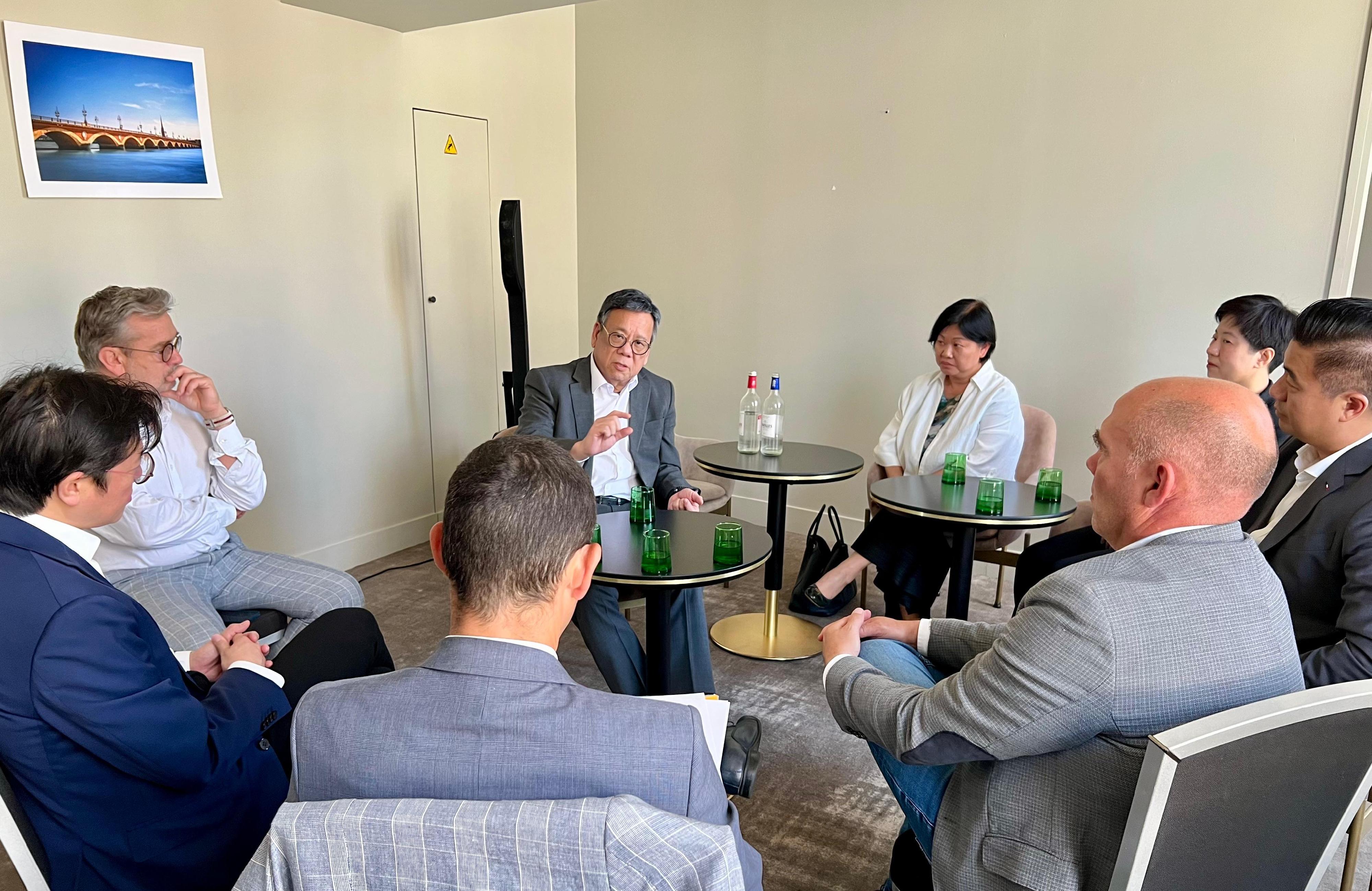 The Secretary for Commerce and Economic Development, Mr Algernon Yau, continued his visit to Bordeaux, France, to promote the advantages of Hong Kong as a wine and liquor trading hub to the local trade. Photo shows Mr Yau (second left) meeting with representatives of the trade of Bordeaux Cognac and Armagnac on June 20 (France time) to exchange views on the latest developments of the trade and enhance co-operation on promoting liquor trading. The Special Representative for Hong Kong Economic and Trade Affairs to the European Union, Ms Shirley Yung (third left), also attended.