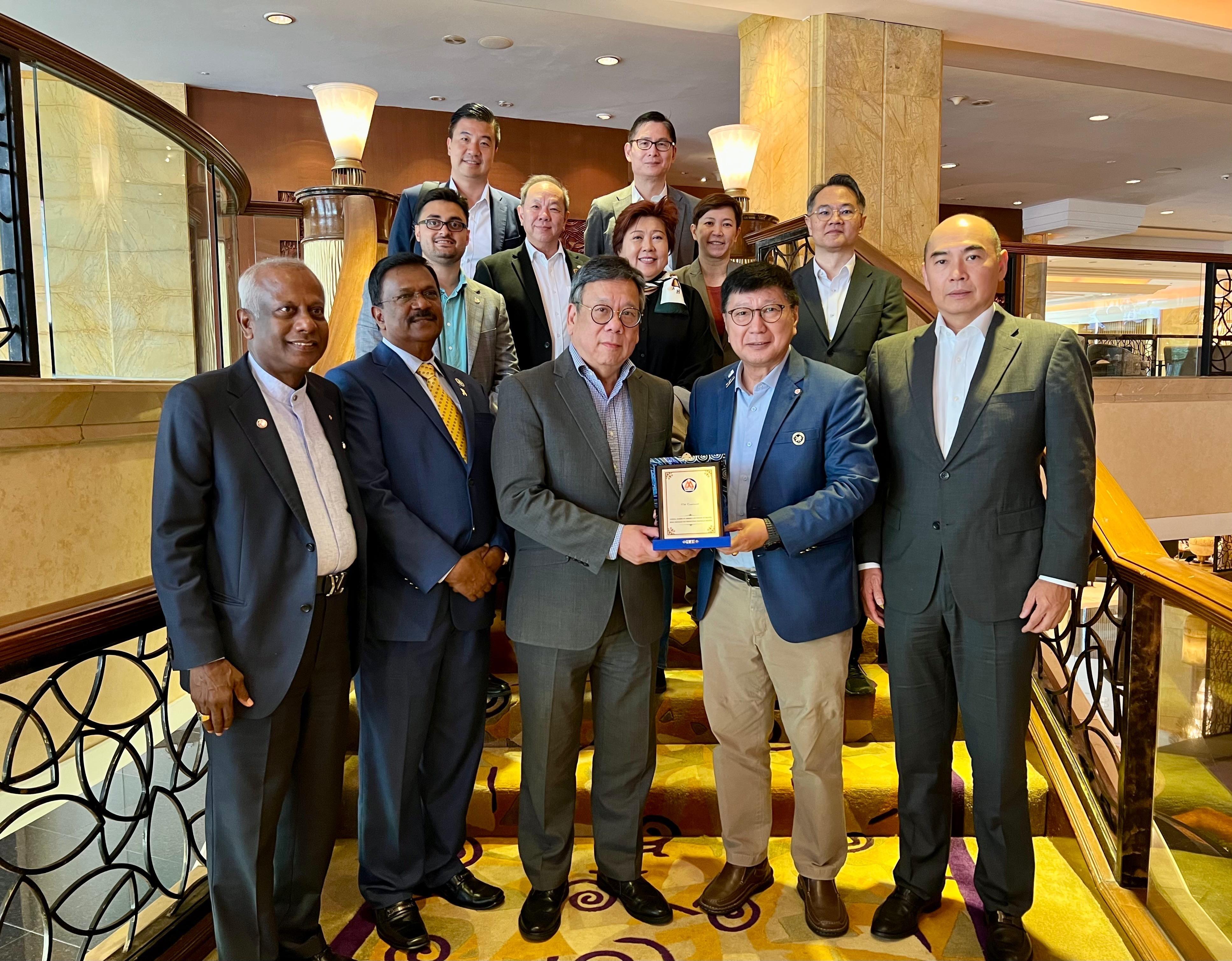 The Secretary for Commerce and Economic Development, Mr Algernon Yau, today (September 25) promoted Hong Kong's premier business environment and fostered further collaboration between Hong Kong and Malaysia to achieve mutual benefits on his visit to Kuala Lumpur, Malaysia. Photo shows Mr Yau (front row, centre) with representatives of the National Chamber of Commerce and Industry of Malaysia after a luncheon. Also pictured are the Director-General of Trade and Industry, Mr Aaron Liu (second row, right), and the Director-General of the Hong Kong Economic and Trade Office in Jakarta, Miss Libera Cheng (third row, right).
