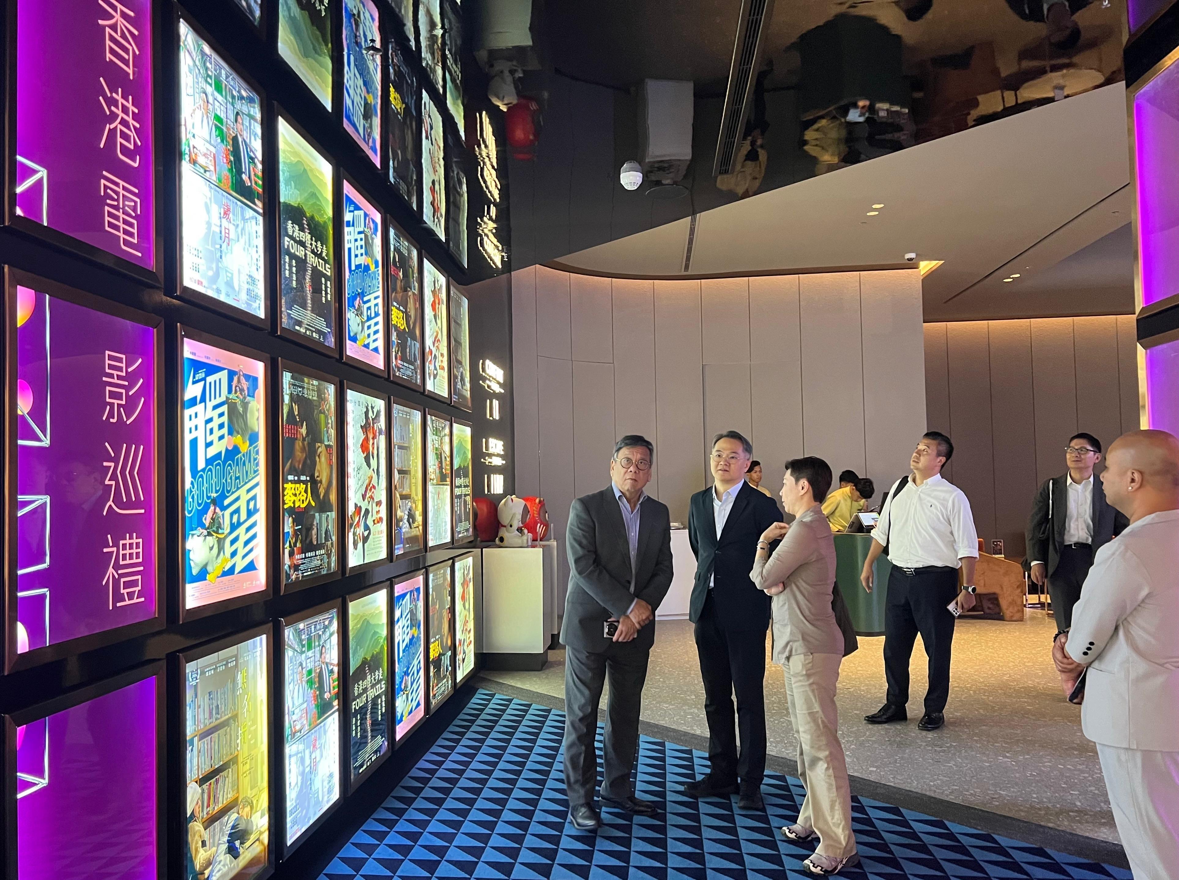 The Secretary for Commerce and Economic Development, Mr Algernon Yau, today (September 25) promoted Hong Kong's premier business environment and fostered further collaboration between Hong Kong and Malaysia to achieve mutual benefits on his visit to Kuala Lumpur, Malaysia. Photo shows Mr Yau (first left), accompanied by the Director-General of Trade and Industry, Mr Aaron Liu (second left), and the Director-General of the Hong Kong Economic and Trade Office in Jakarta (Jakarta ETO), Miss Libera Cheng (third left), visiting an event sponsored by the Jakarta ETO yesterday (September 24) to promote Hong Kong movies.