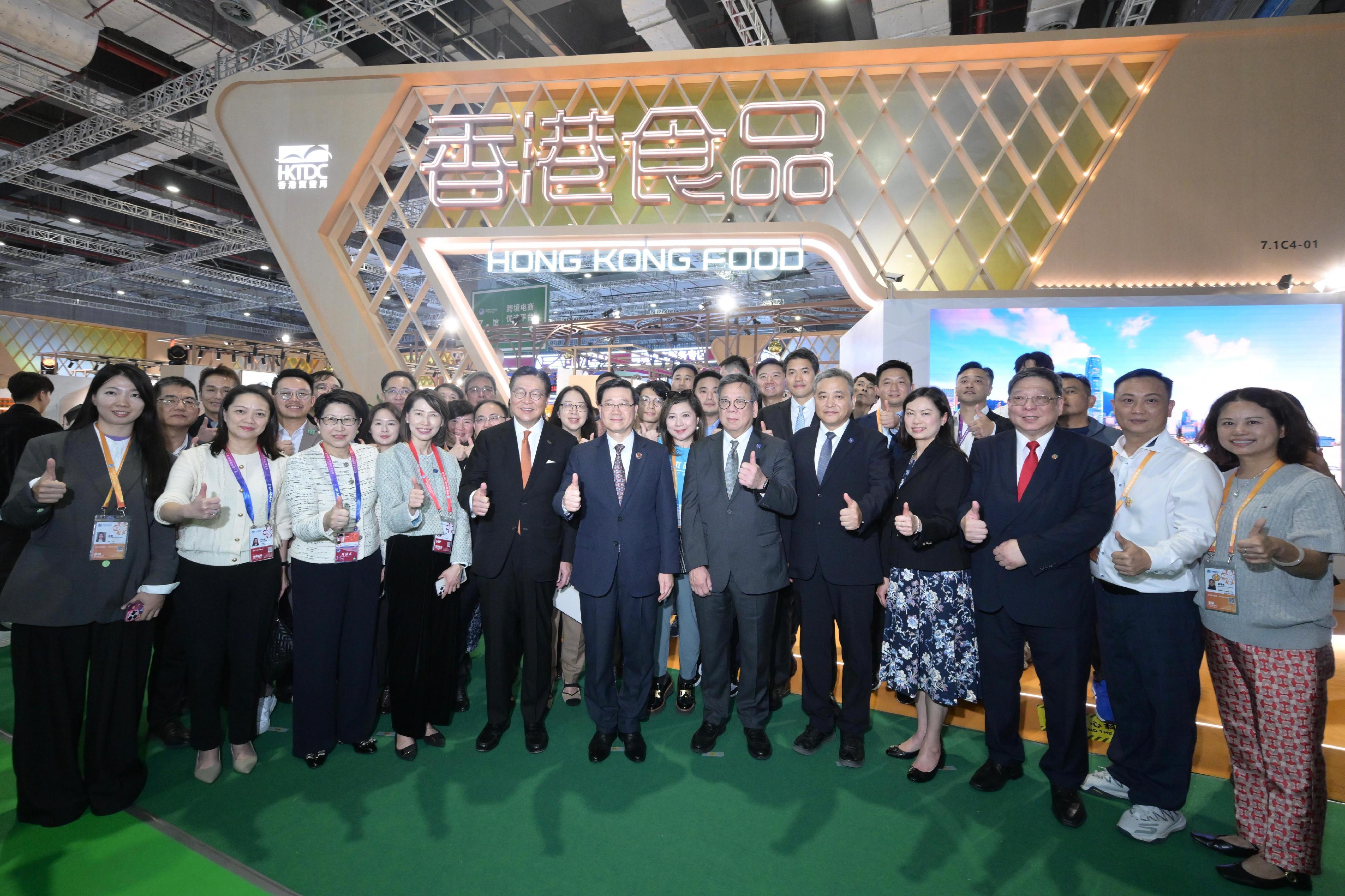 he Chief Executive, Mr John Lee, toured the eighth China International Import Expo in Shanghai today (November 5). Photo shows (front row, from third left) the Executive Director of the Hong Kong Trade Development Council, Ms Sophia Chong; the Director of the Chief Executive's Office, Ms Carol Yip; the Chairman of the Hong Kong Trade Development Council, Professor Frederick Ma; Mr Lee; and the Secretary for Commerce and Economic Development, Mr Algernon Yau, with other guests at the Hong Kong Food Pavilion.